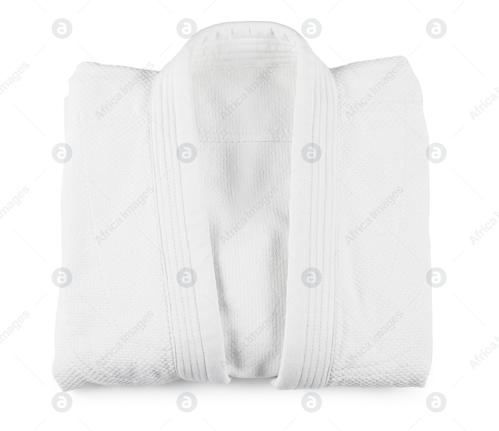 Photo of Folded kimono isolated on white, top view. Martial arts uniform