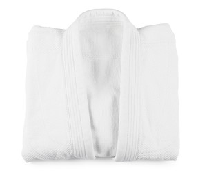 Photo of Folded kimono isolated on white, top view. Martial arts uniform