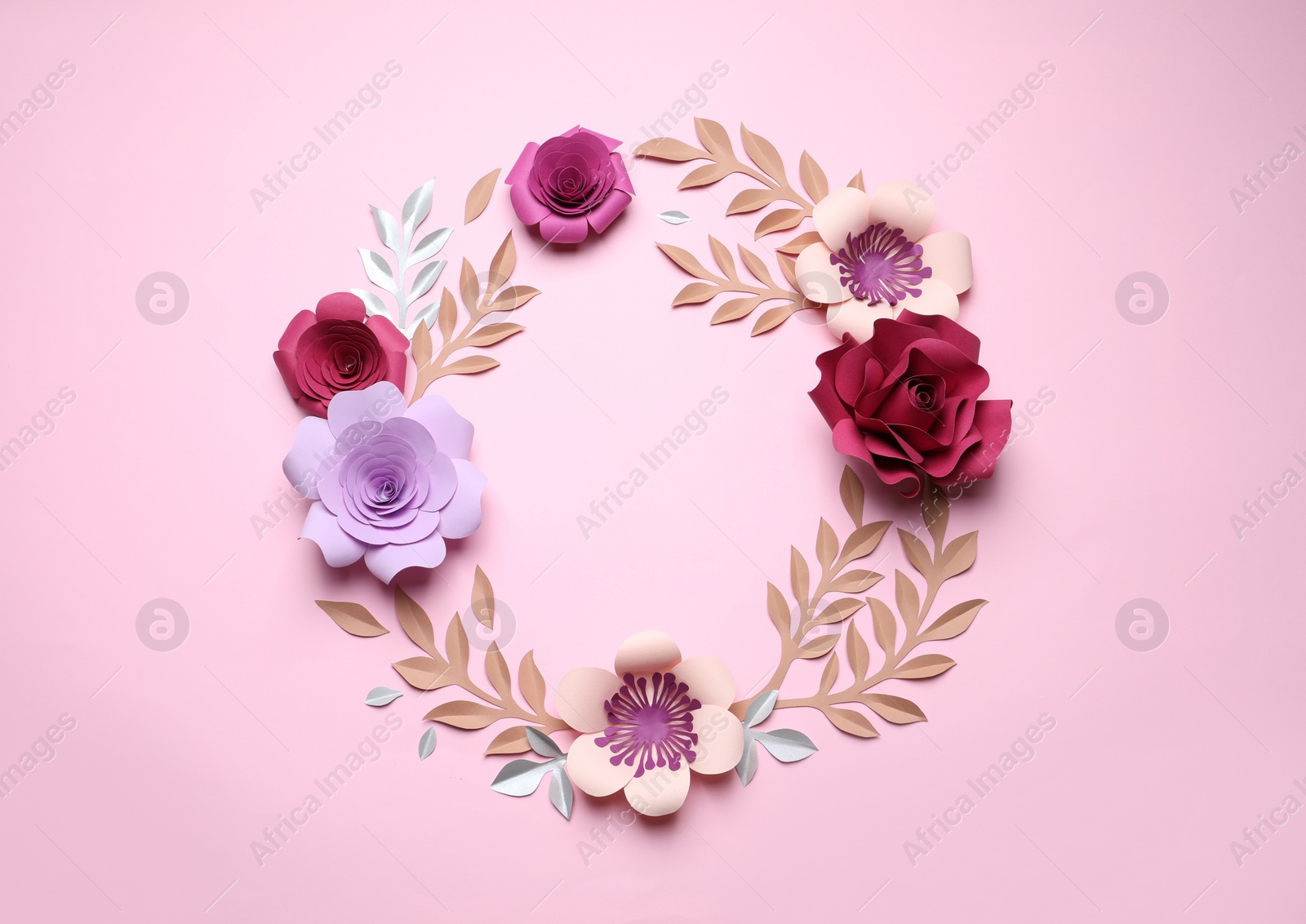 Photo of Frame of beautiful paper flowers on pink background, flat lay. Space for text