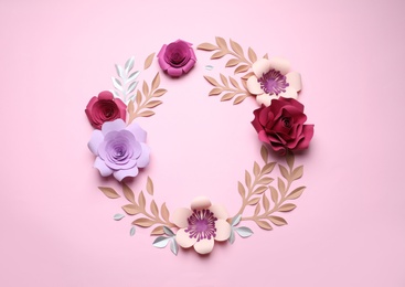 Frame of beautiful paper flowers on pink background, flat lay. Space for text