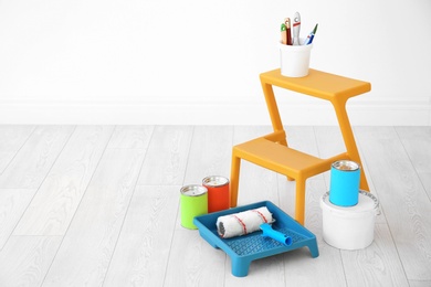 Photo of Decorator's tools on floor in room