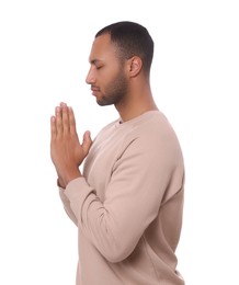 Photo of African American man with clasped hands praying to God on white background
