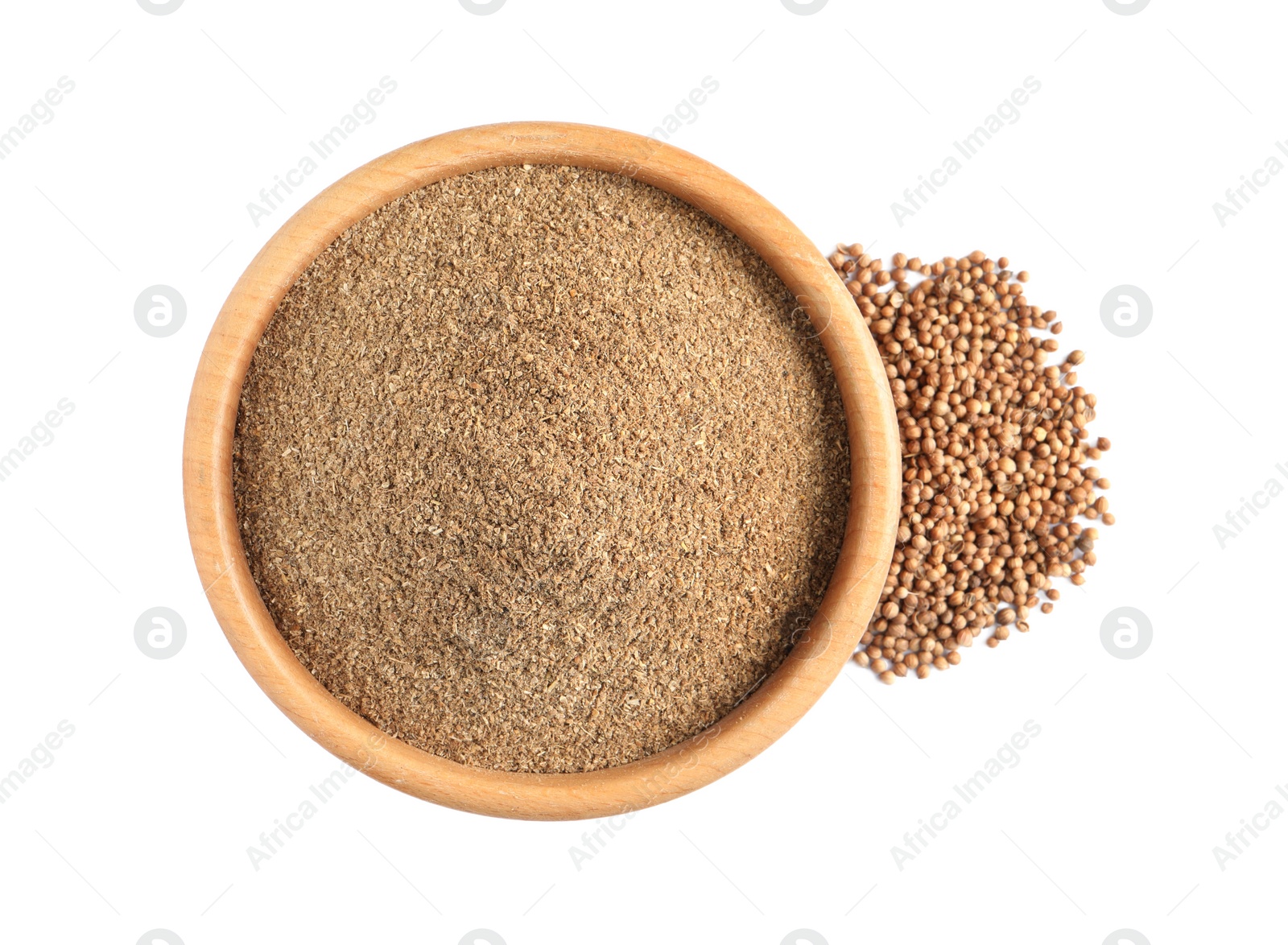 Photo of Wooden bowl with powdered coriander and corns on white background, top view