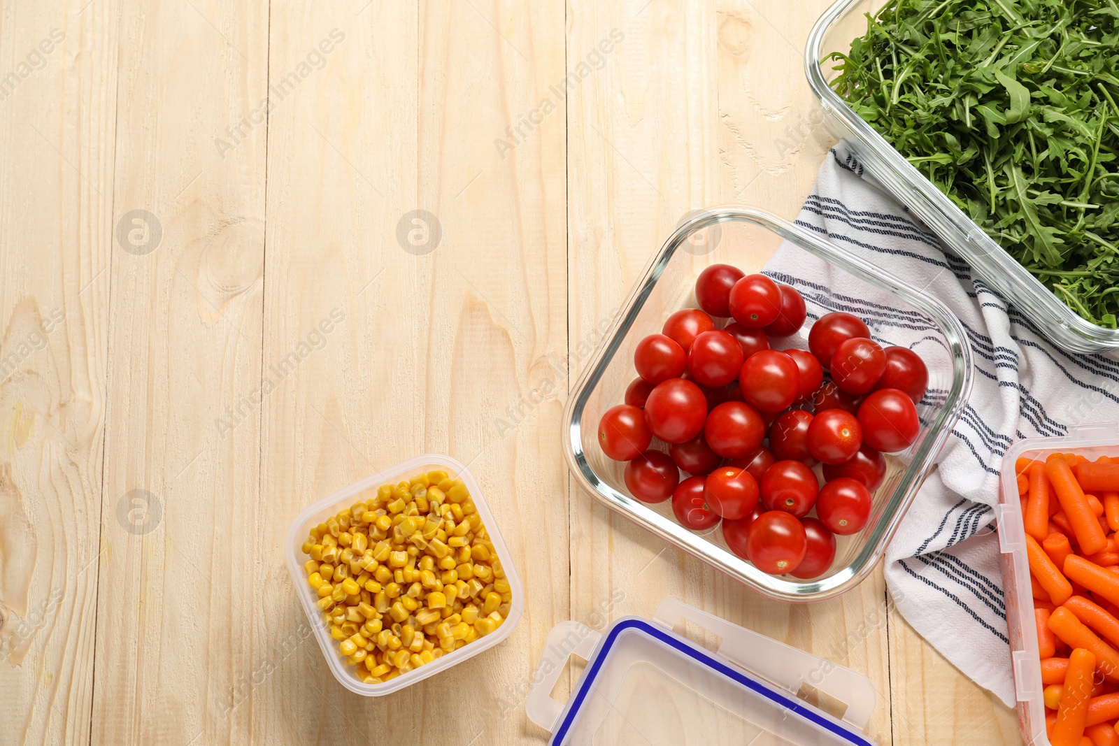 Photo of Containers with fresh products on wooden table, flat lay with space for text. Food storage