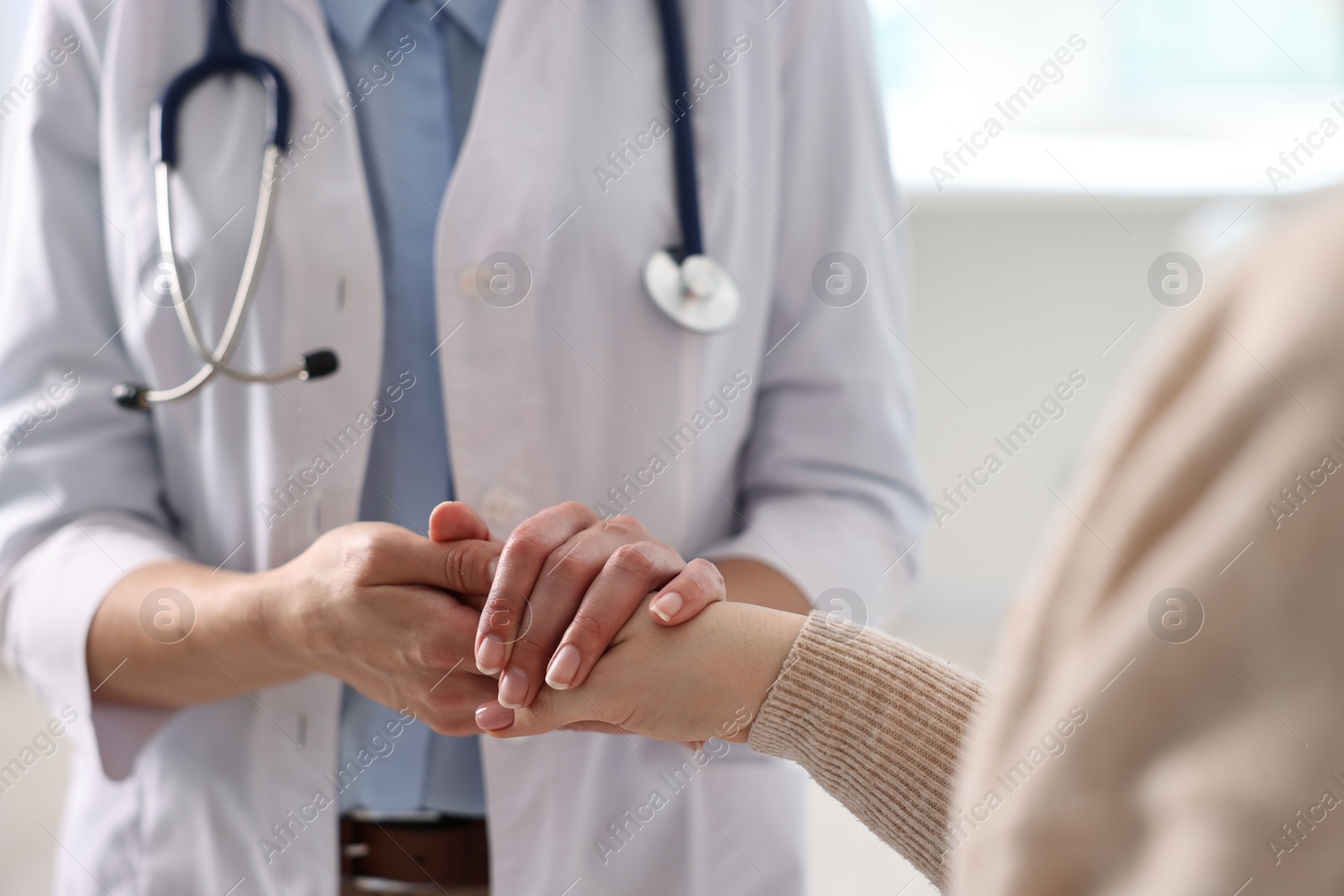 Photo of Professional doctor working with patient in hospital, closeup