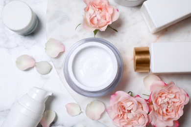 Photo of Flat lay composition with different skin care products on white marble background