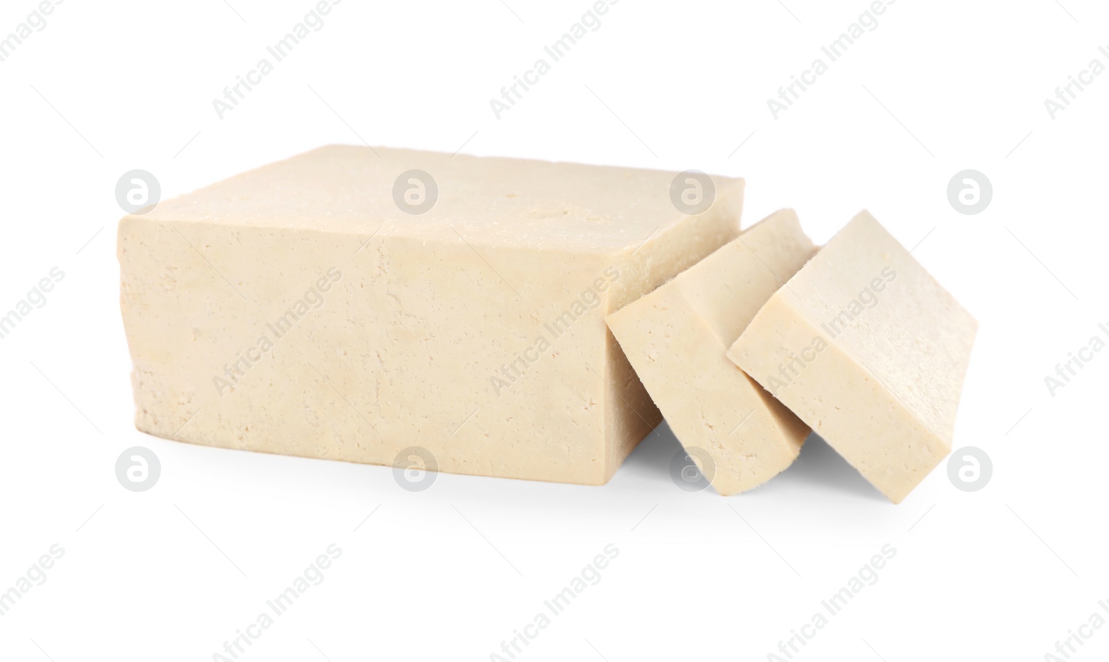 Photo of Cut raw tofu block on white background