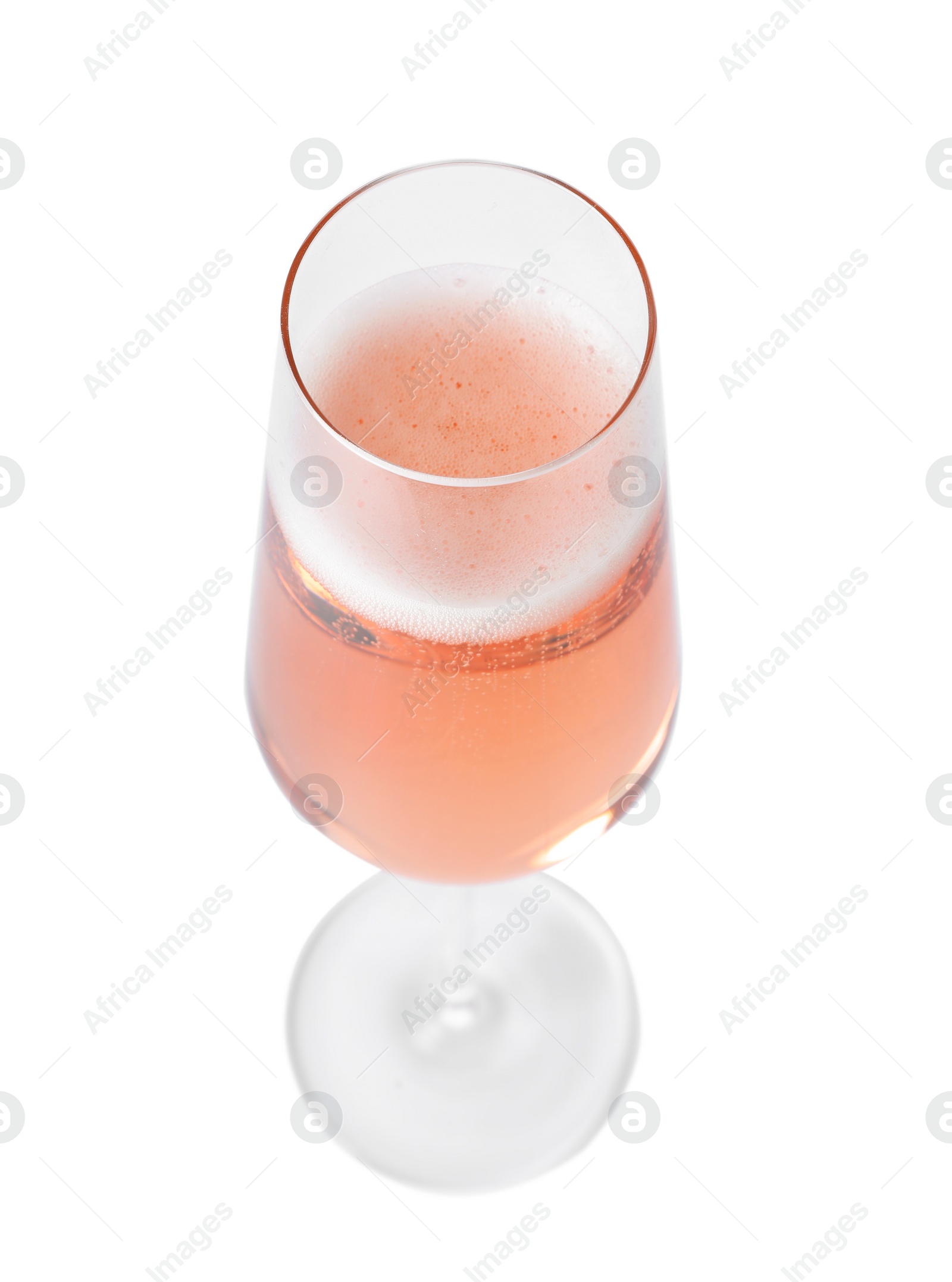 Photo of Glass of rose champagne isolated on white