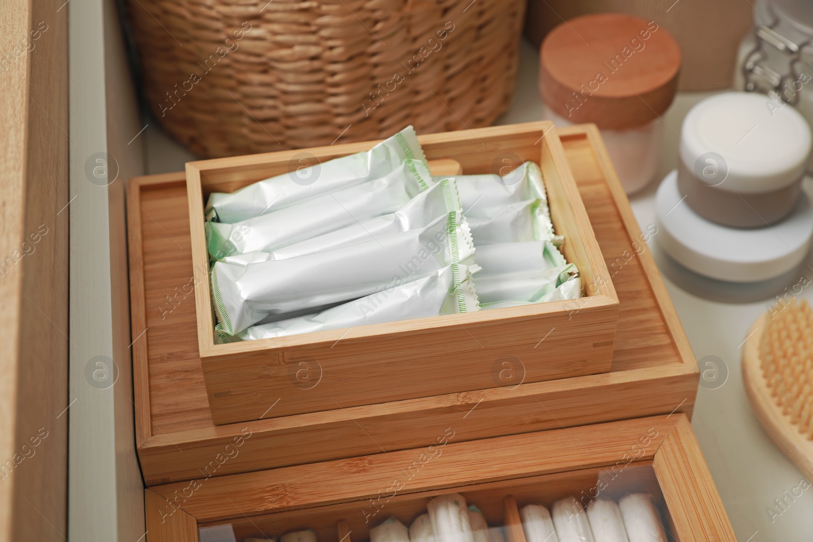 Photo of Keeping tampons and other self care products in drawer, closeup