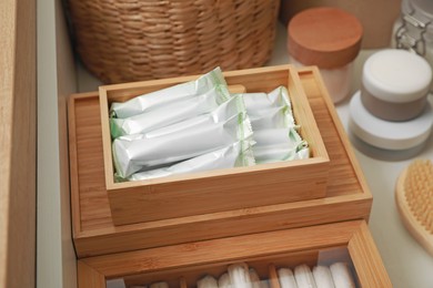 Photo of Keeping tampons and other self care products in drawer, closeup