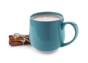 Photo of Delicious cocoa drink in blue cup and cinnamon sticks on white background