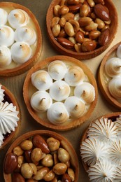 Many different tartlets on golden tray, top view. Delicious dessert