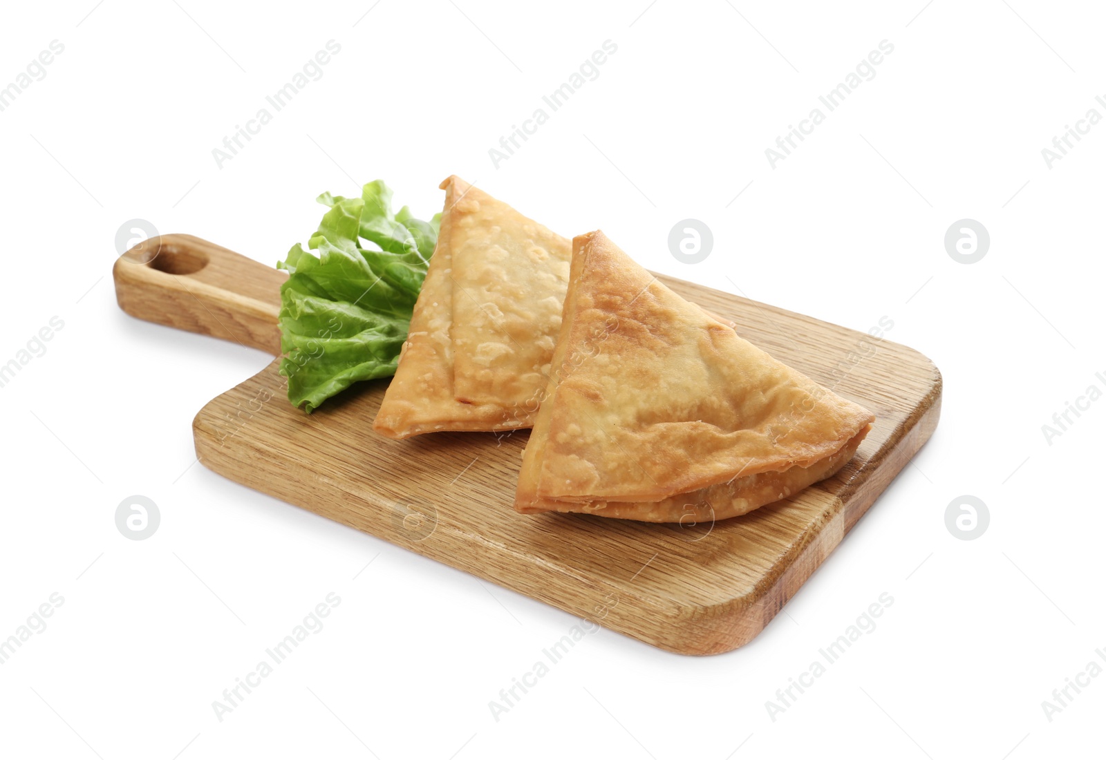 Photo of Fresh delicious crispy samosas and lettuce on white background