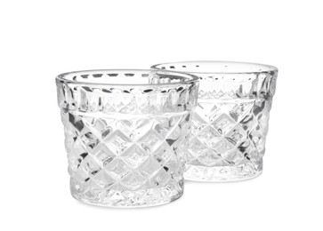 Two modern glass candle holders on white background