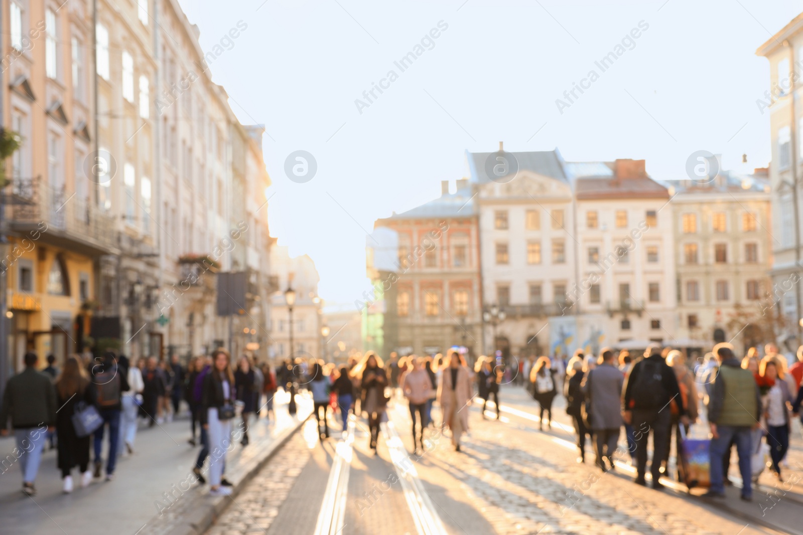 Photo of Blurred view of people walking on city street