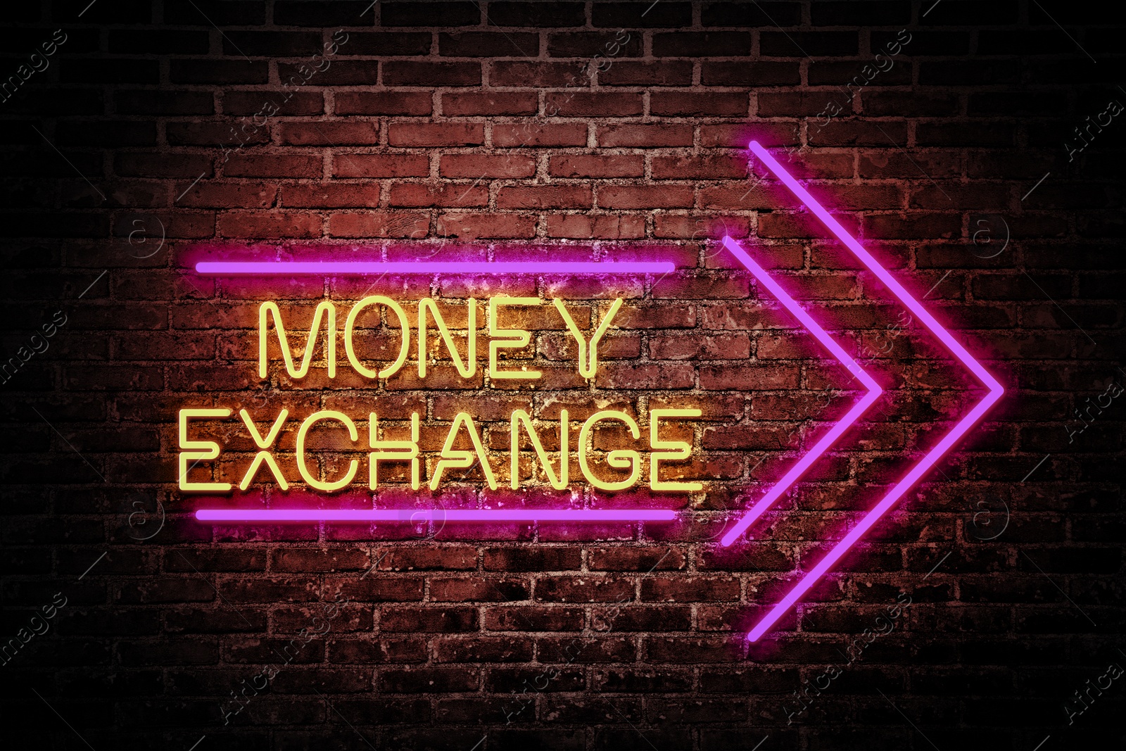Image of Money Exchange neon sign on brick wall. Bright yellow text and pink arrow