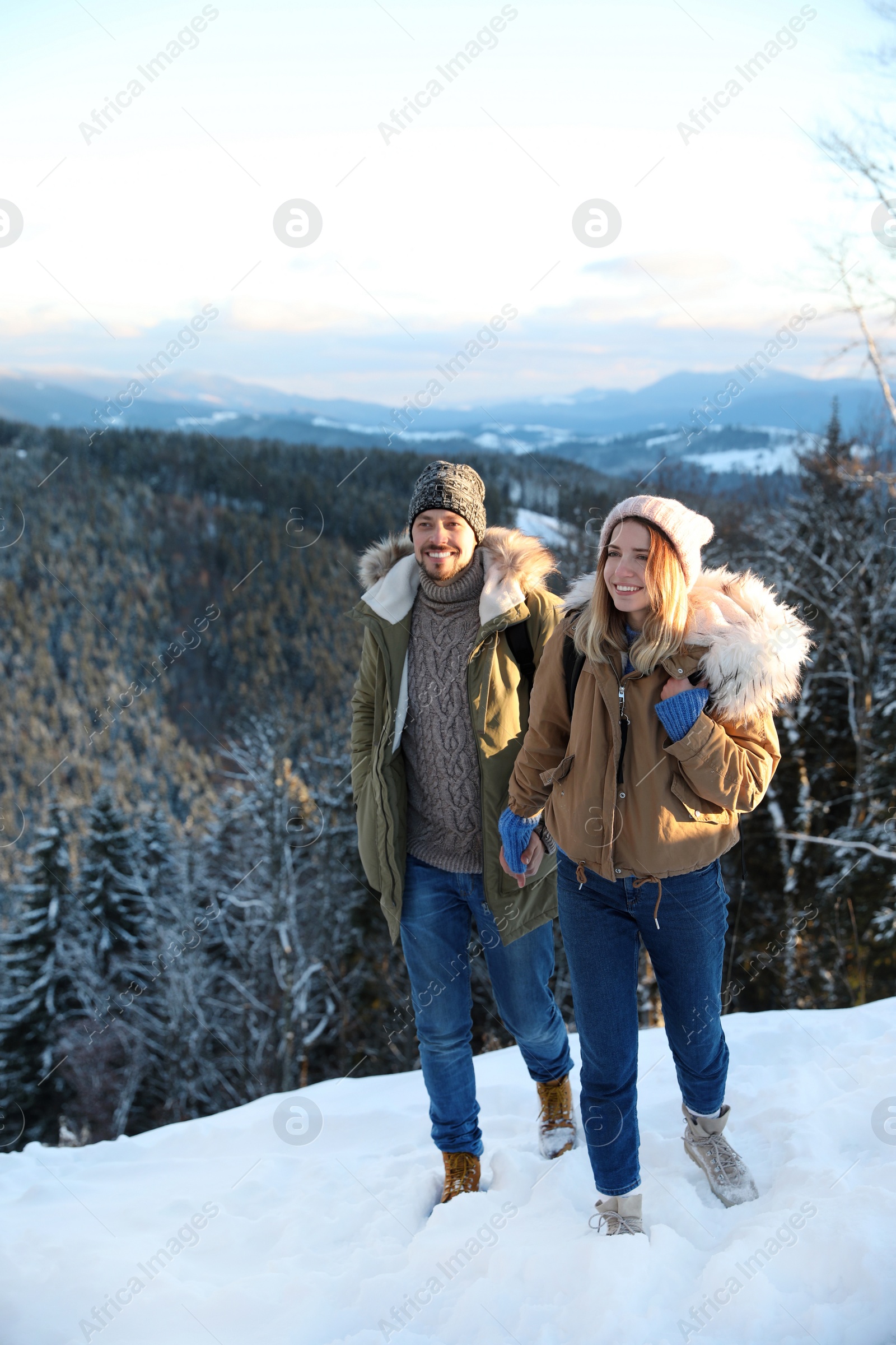 Photo of Happy couple spending winter vacation together in mountains