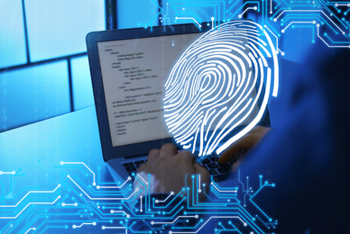 Image of Fingerprint identification. Man working with laptop at table, closeup