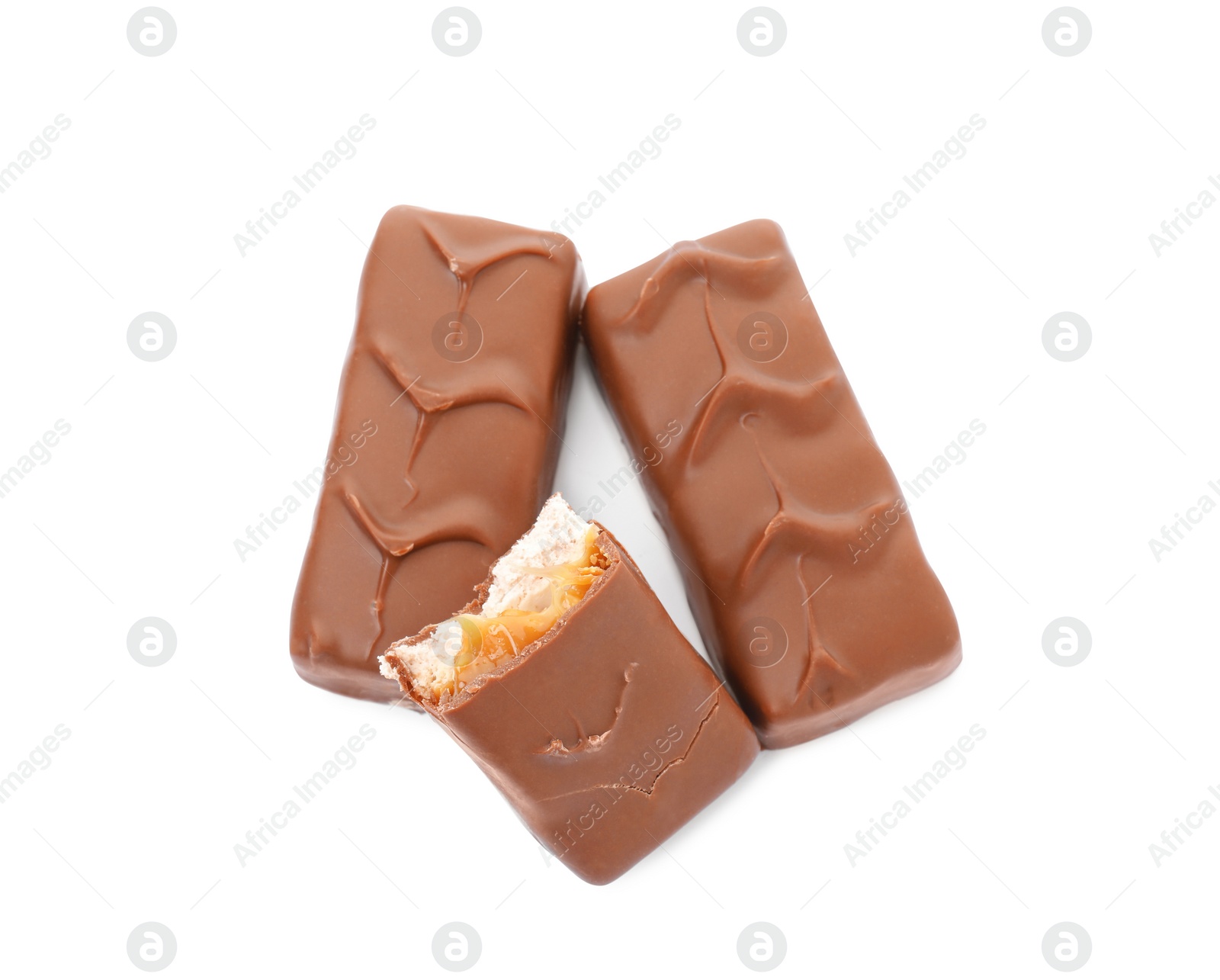 Photo of Chocolate bars with caramel, nuts and nougat isolated on white, top view