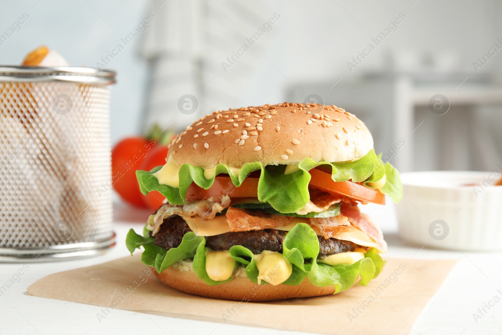 Photo of Tasty burger with bacon served on table