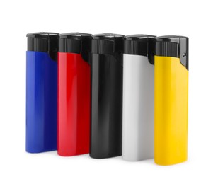 Photo of Stylish small pocket lighters on white background