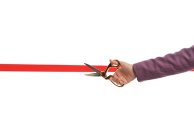 Photo of Woman in office suit cutting red ribbon isolated on white, closeup