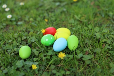 Photo of Easter celebration. Painted eggs on green grass