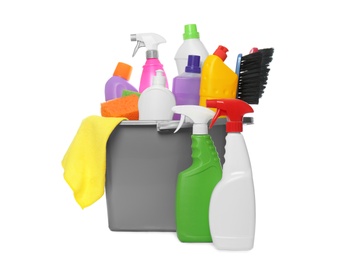 Bucket with different cleaning products and tools on white background