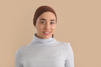 Smiling woman with cancer on beige background