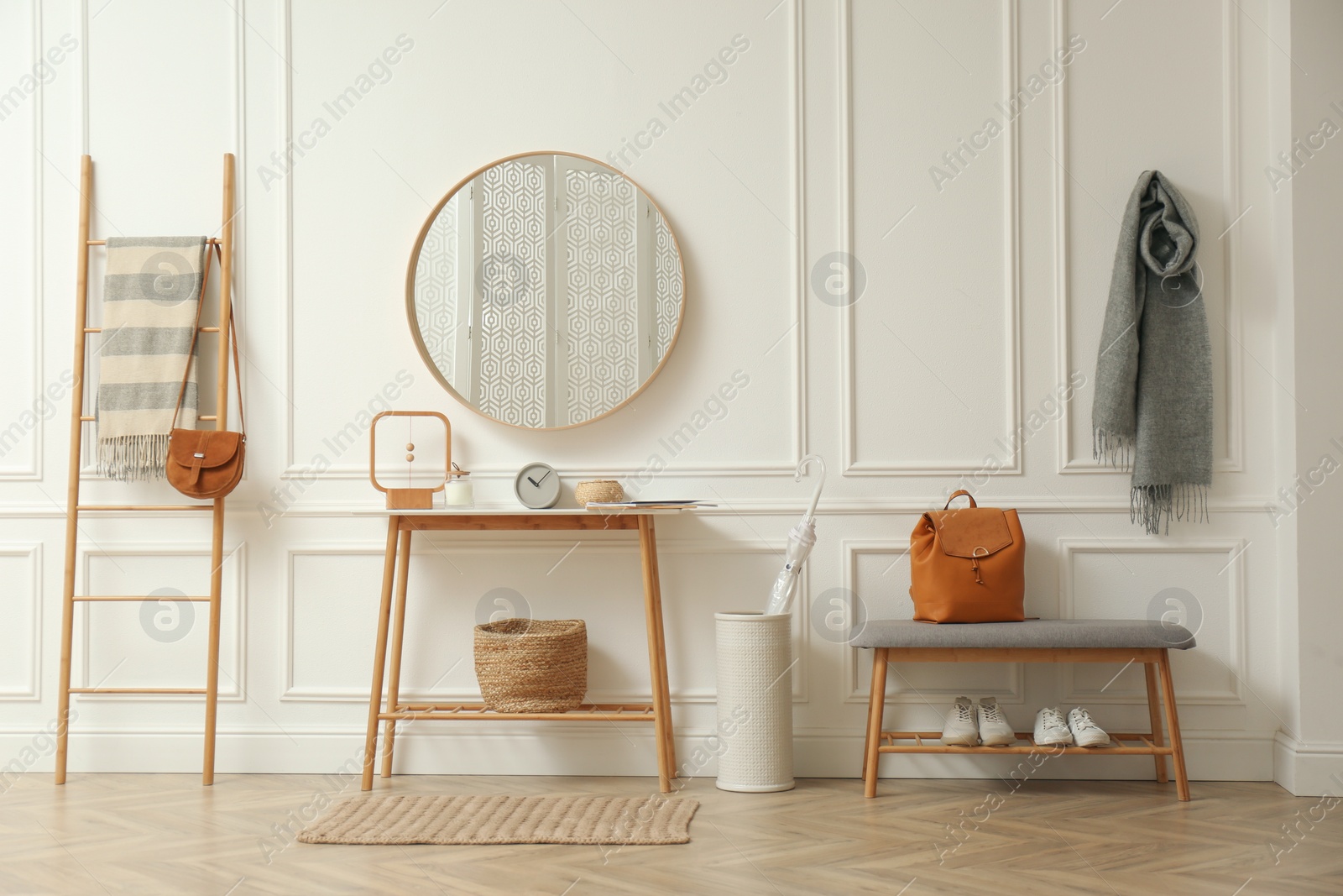 Photo of Hallway interior with stylish furniture, clothes and accessories