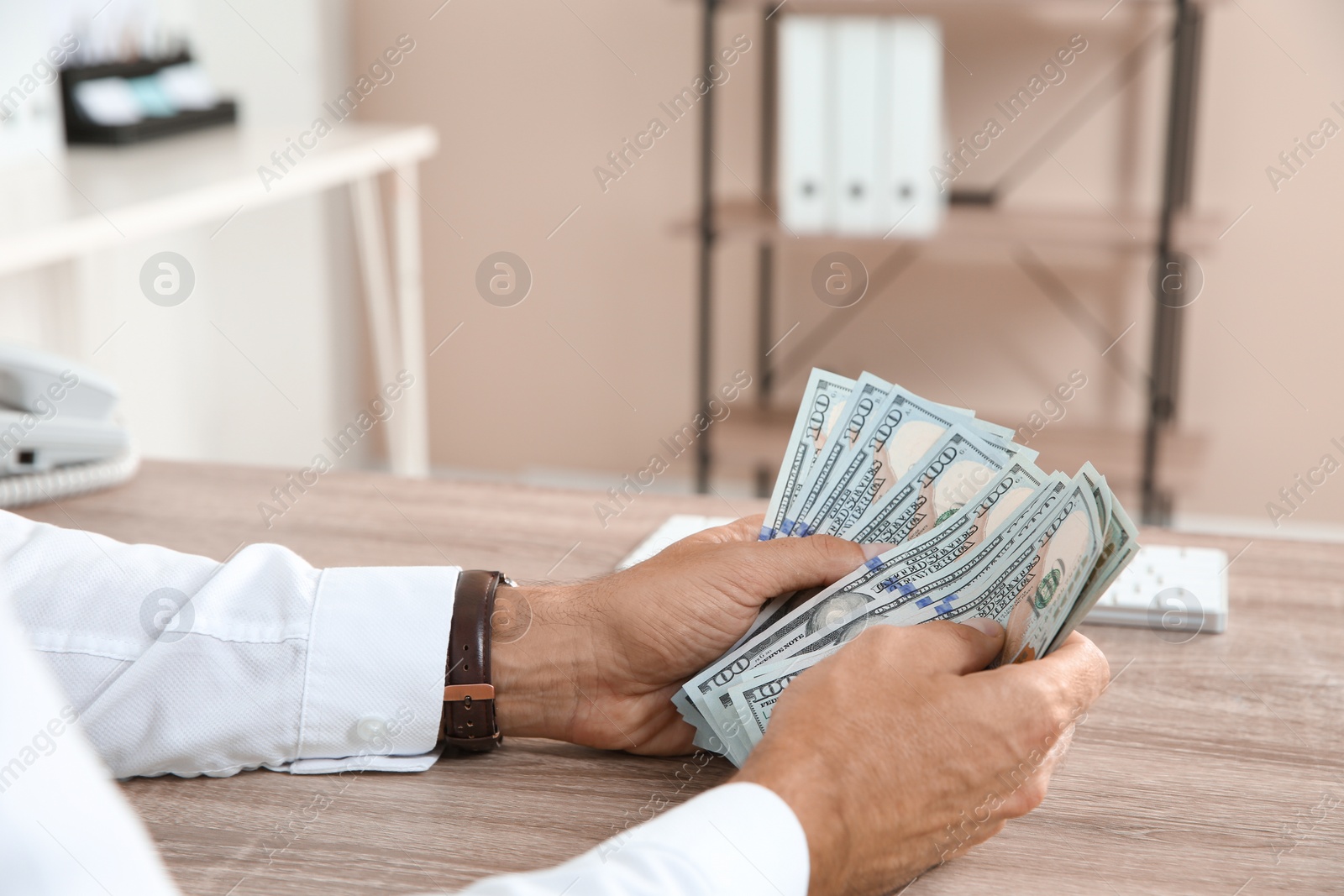 Photo of Man with money at cash department, closeup