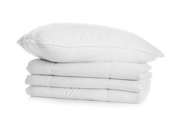 Folded clean blanket and pillow isolated on white