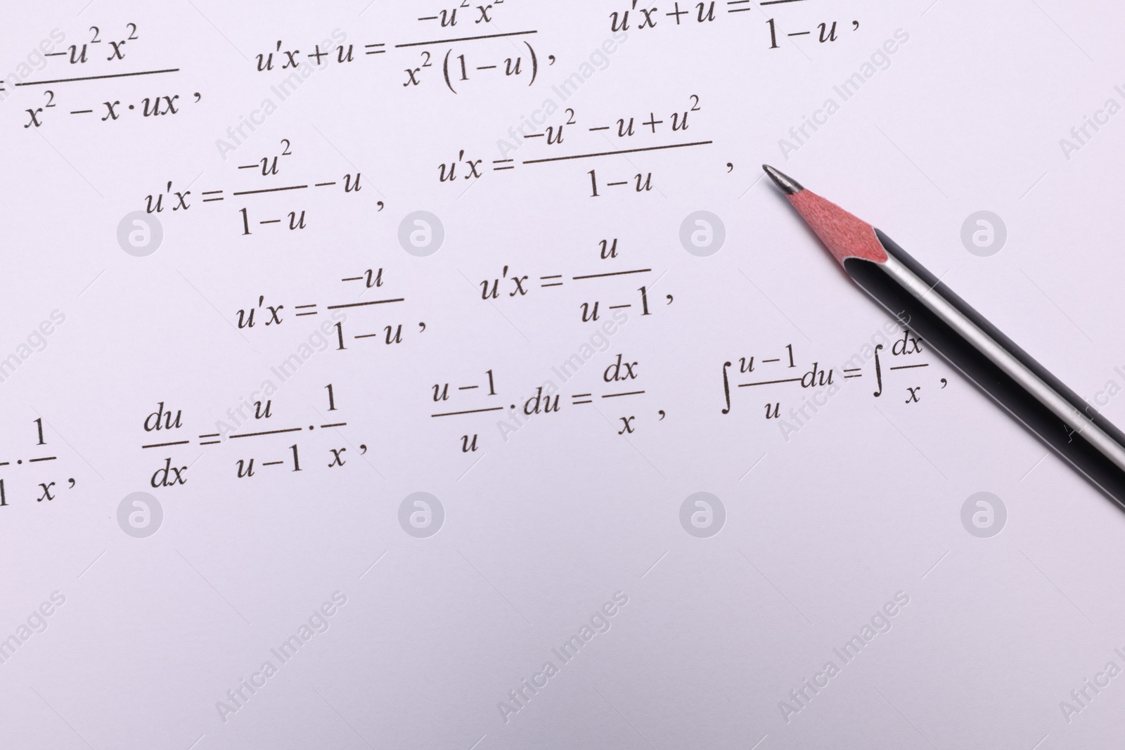 Photo of Sheet of paper with mathematical formulas and pencil, top view