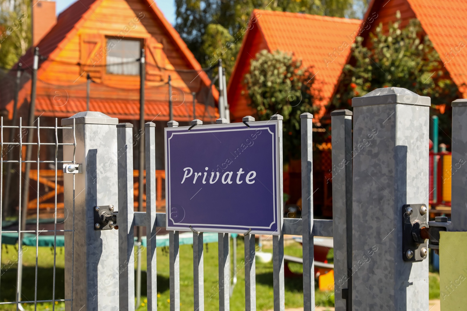 Image of Blue sign with word Private on fence