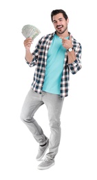 Handsome young man with dollars on white background