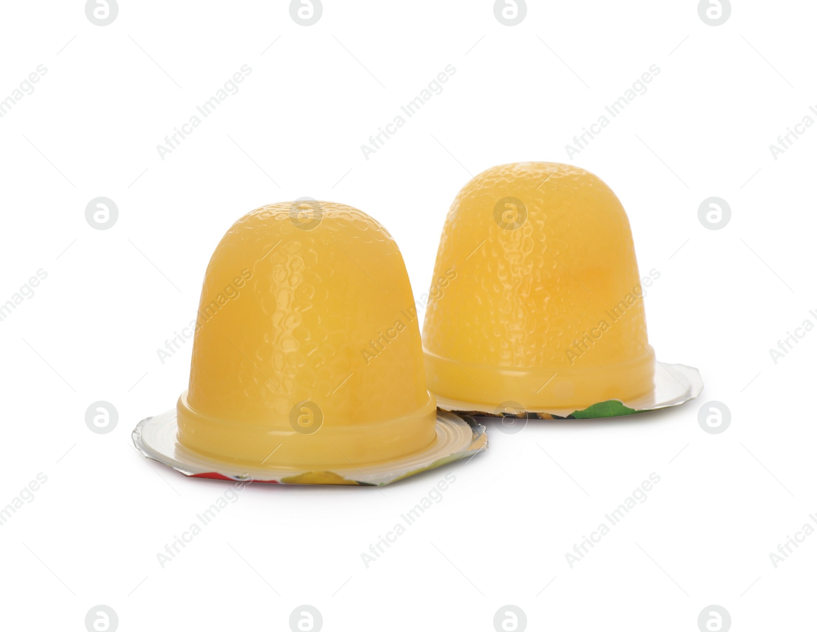 Photo of Delicious yellow jelly cups on white background