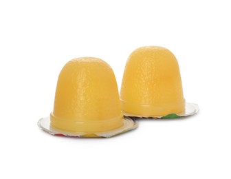 Delicious yellow jelly cups on white background