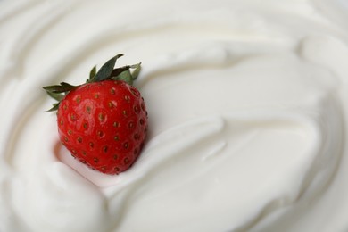 Tasty yogurt with strawberry as background, top view. Space for text