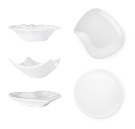 Image of Set with empty plates and bowls on white background