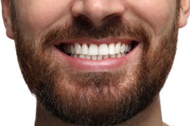 Photo of Smiling man with healthy clean teeth on white background, closeup