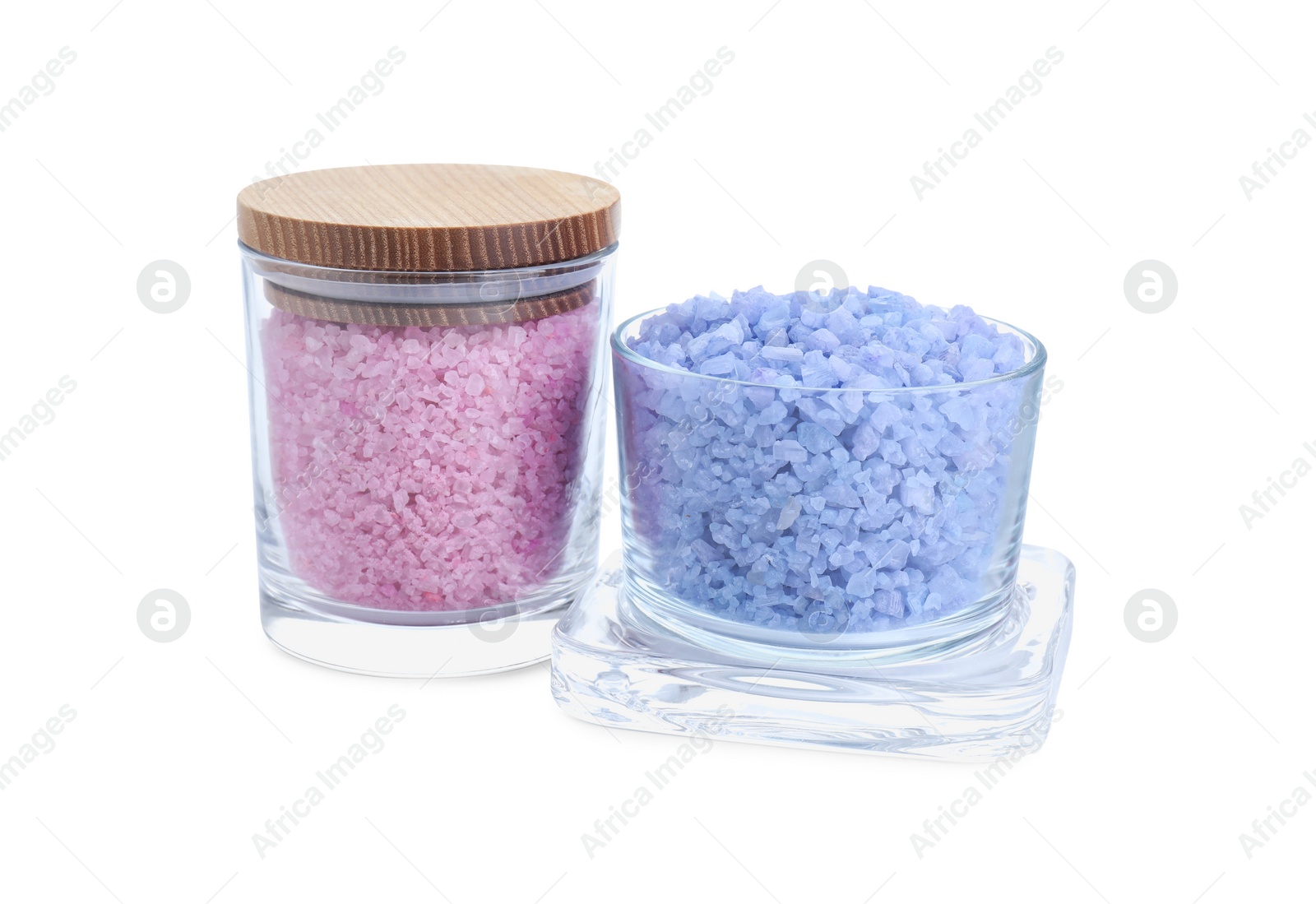 Photo of Glass containers of different sea salt isolated on white