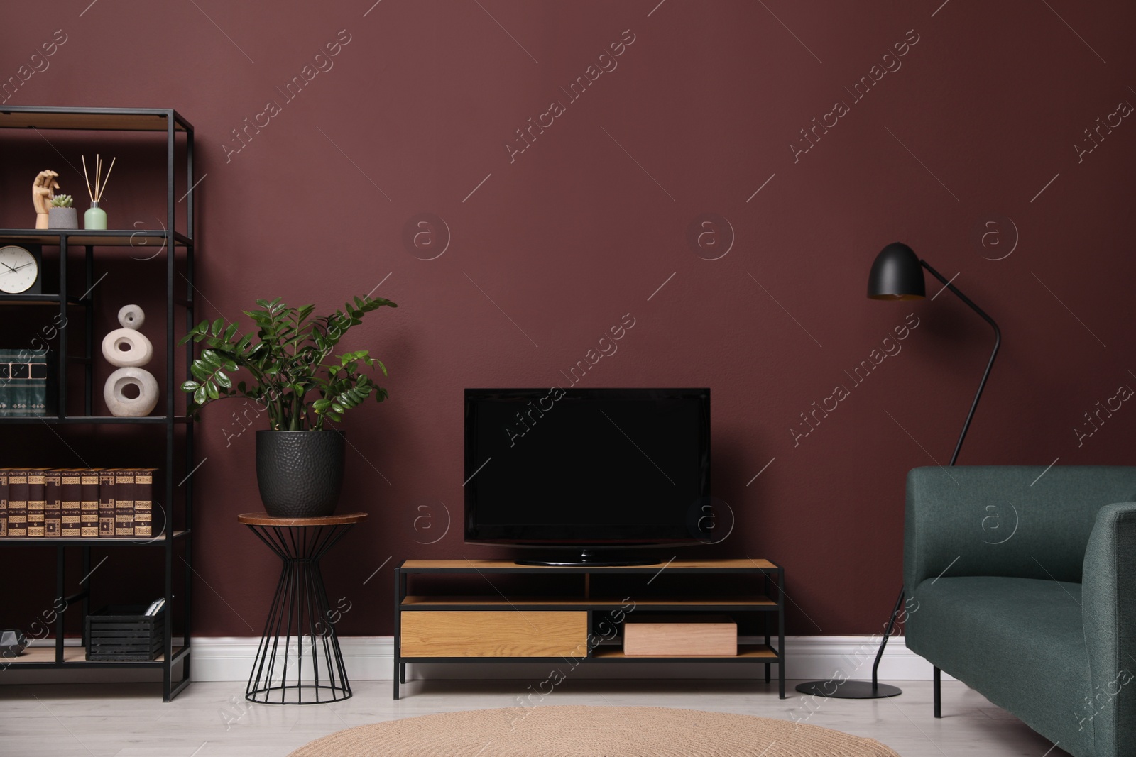 Photo of Elegant room interior with modern TV on cabinet, sofa and floor lamp