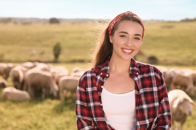 Photo of Portrait of smiling woman on animal farm. Space for text