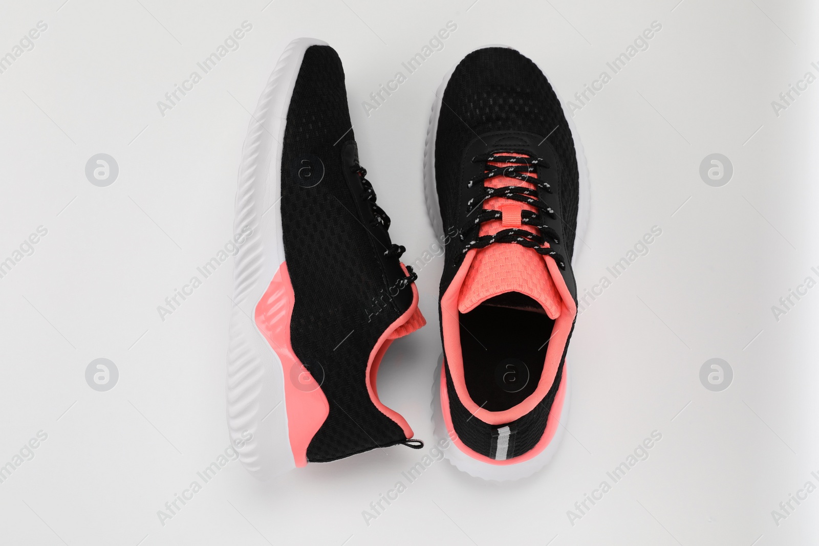 Photo of Pair of stylish sport shoes on white background, flat lay