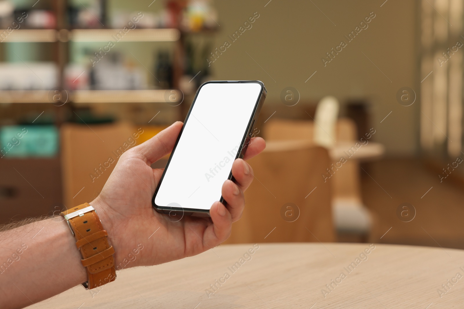 Photo of Man using smartphone in cafe, closeup. Space for text