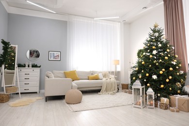 Christmas tree in furnished living room. Festive interior design