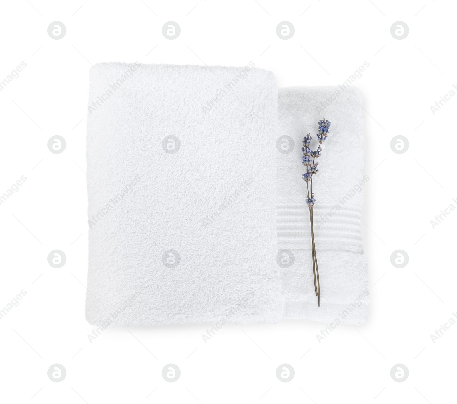 Photo of Terry towels and lavender flowers isolated on white, top view
