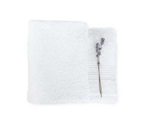 Terry towels and lavender flowers isolated on white, top view