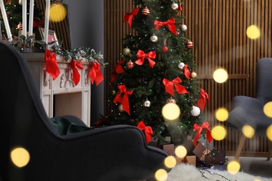 Photo of Stylish living room interior with decorated Christmas tree