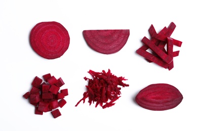 Photo of Composition with cut raw beets on white background, top view